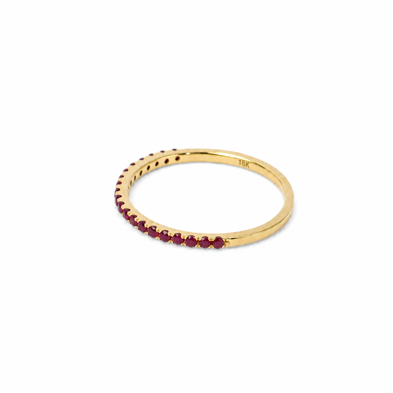 Anillo medio riviere de rubíes en oro amarillo 18K